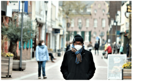 Man in street with face mask